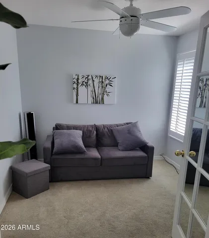 a living room with furniture and a window