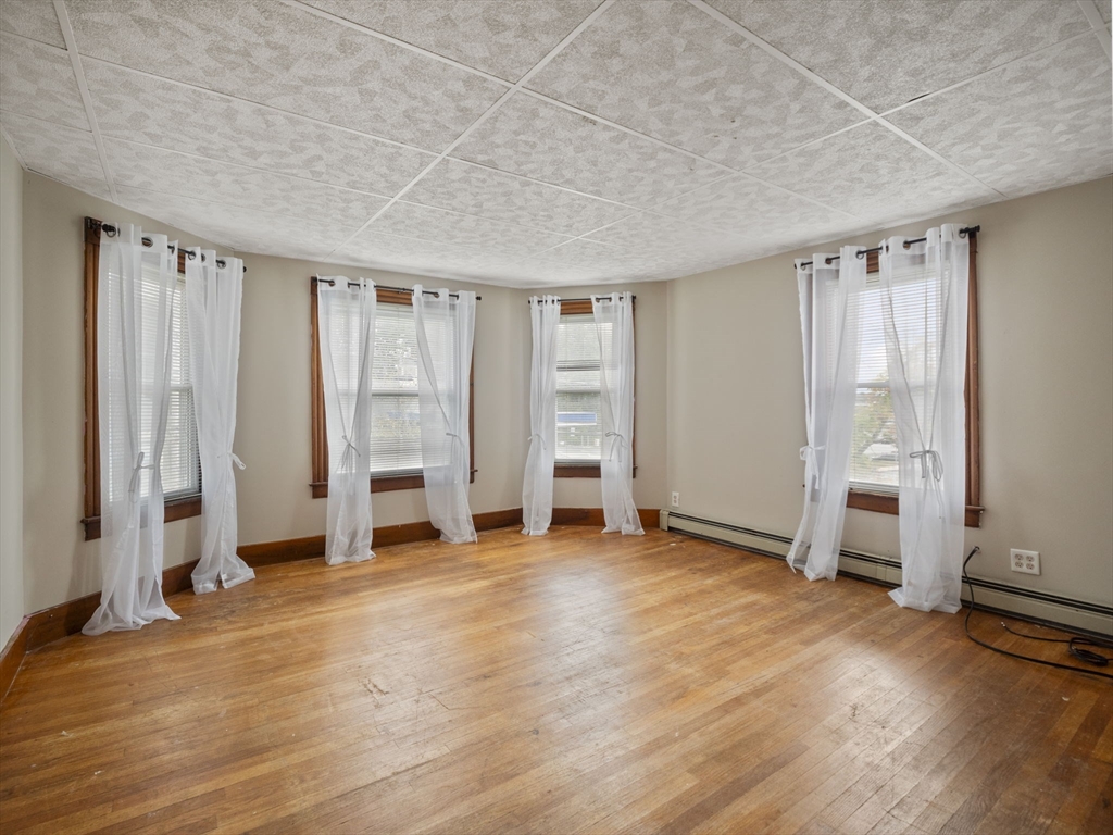 2154 Main Street Athol, MA 01331 - Photo 16 of 40 an empty room with wooden floor and closet
