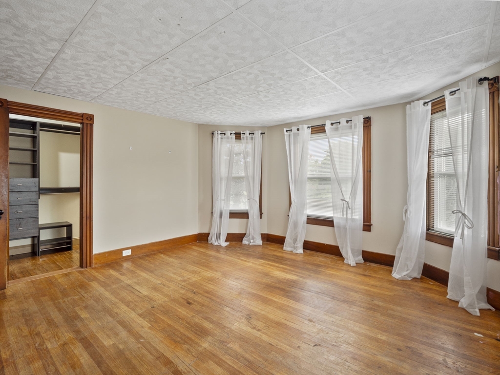 2154 Main Street Athol, MA 01331 - Photo 17 of 40 an empty room with wooden floor and a window