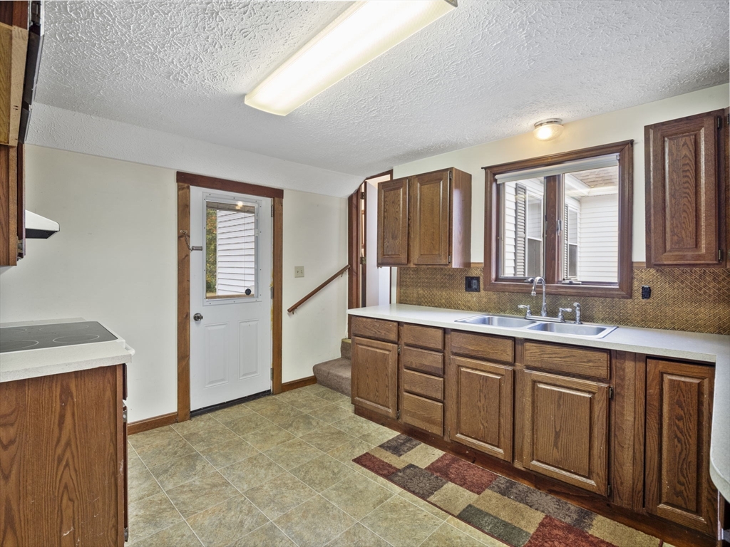 2154 Main Street Athol, MA 01331 - Photo 24 of 40 a spacious bathroom with a granite countertop sink and a mirror