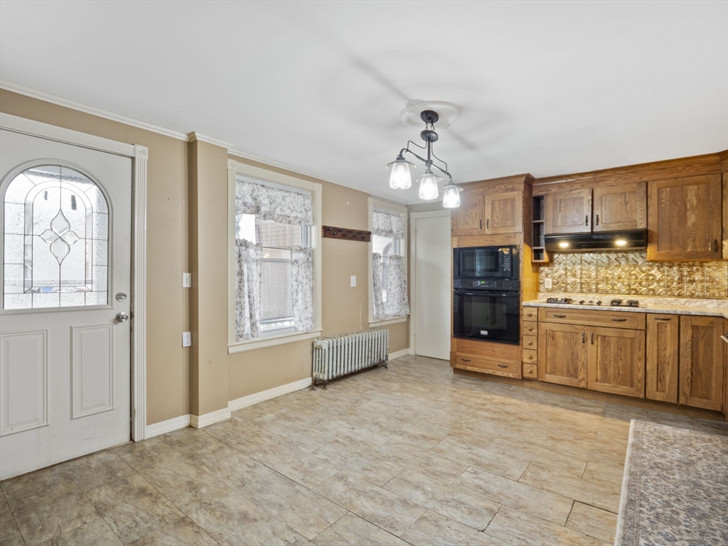 2154 Main Street Athol, MA 01331 - Photo 3 of 40 a view of a kitchen with a sink and dishwasher a stove top oven with wooden floor