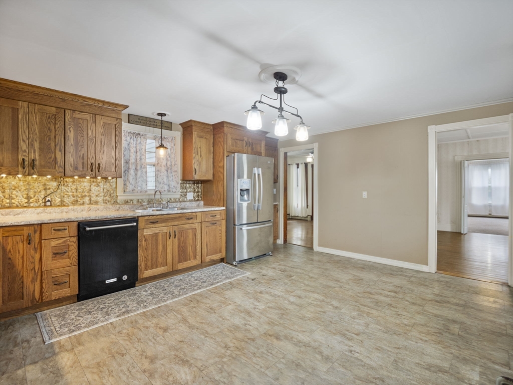 2154 Main Street Athol, MA 01331 - Photo 5 of 40 a large kitchen with a refrigerator and cabinets