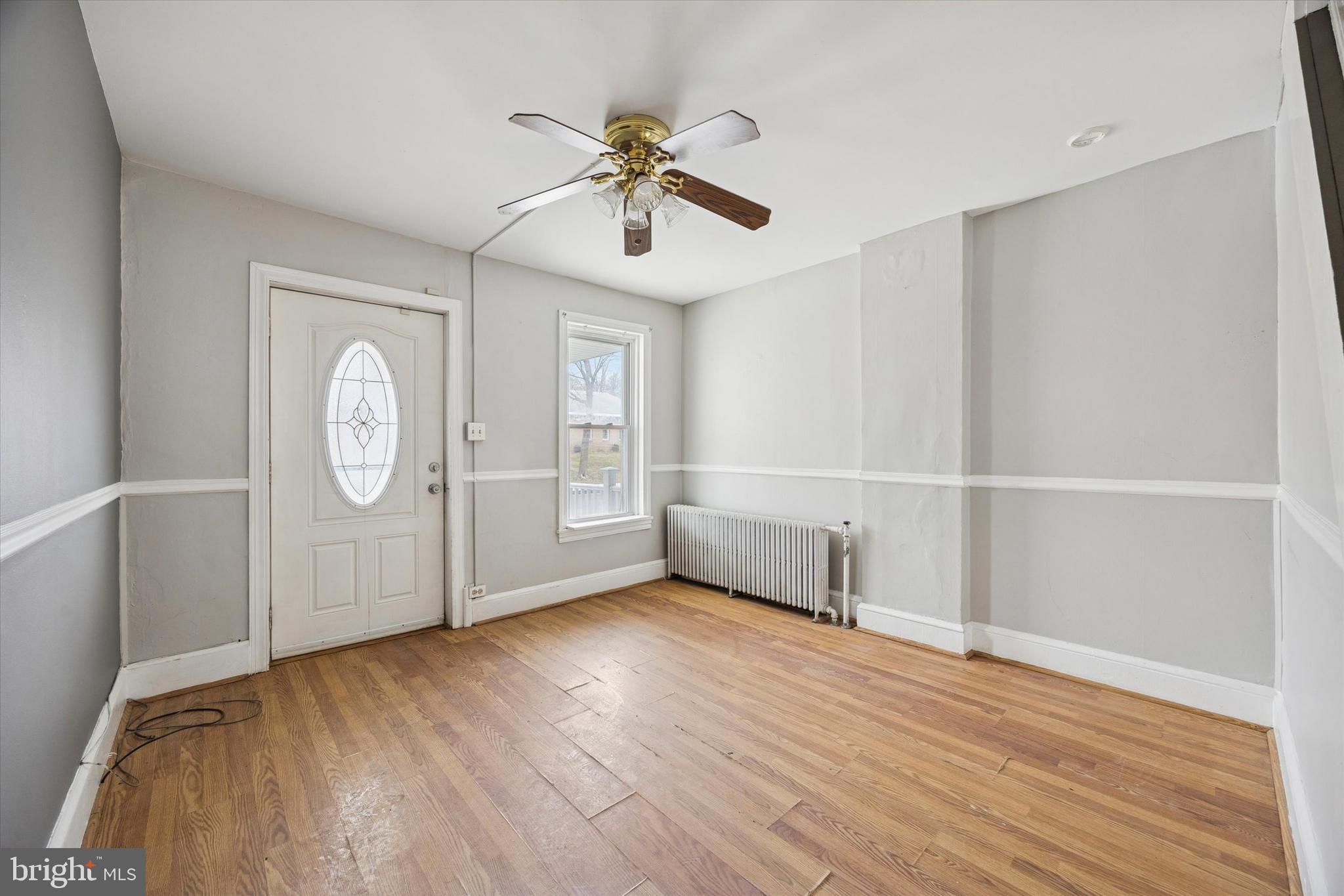 544 Walnut Street Pottstown, PA 19464 - Photo 2 of 14 a view of an empty room with wooden floor and windows