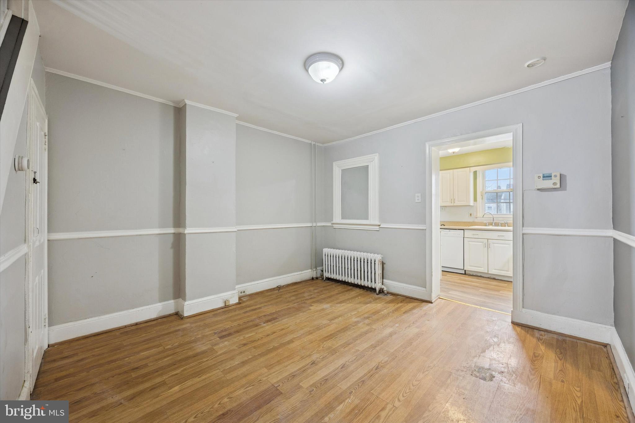544 Walnut Street Pottstown, PA 19464 - Photo 3 of 14 an empty room with wooden floor and windows