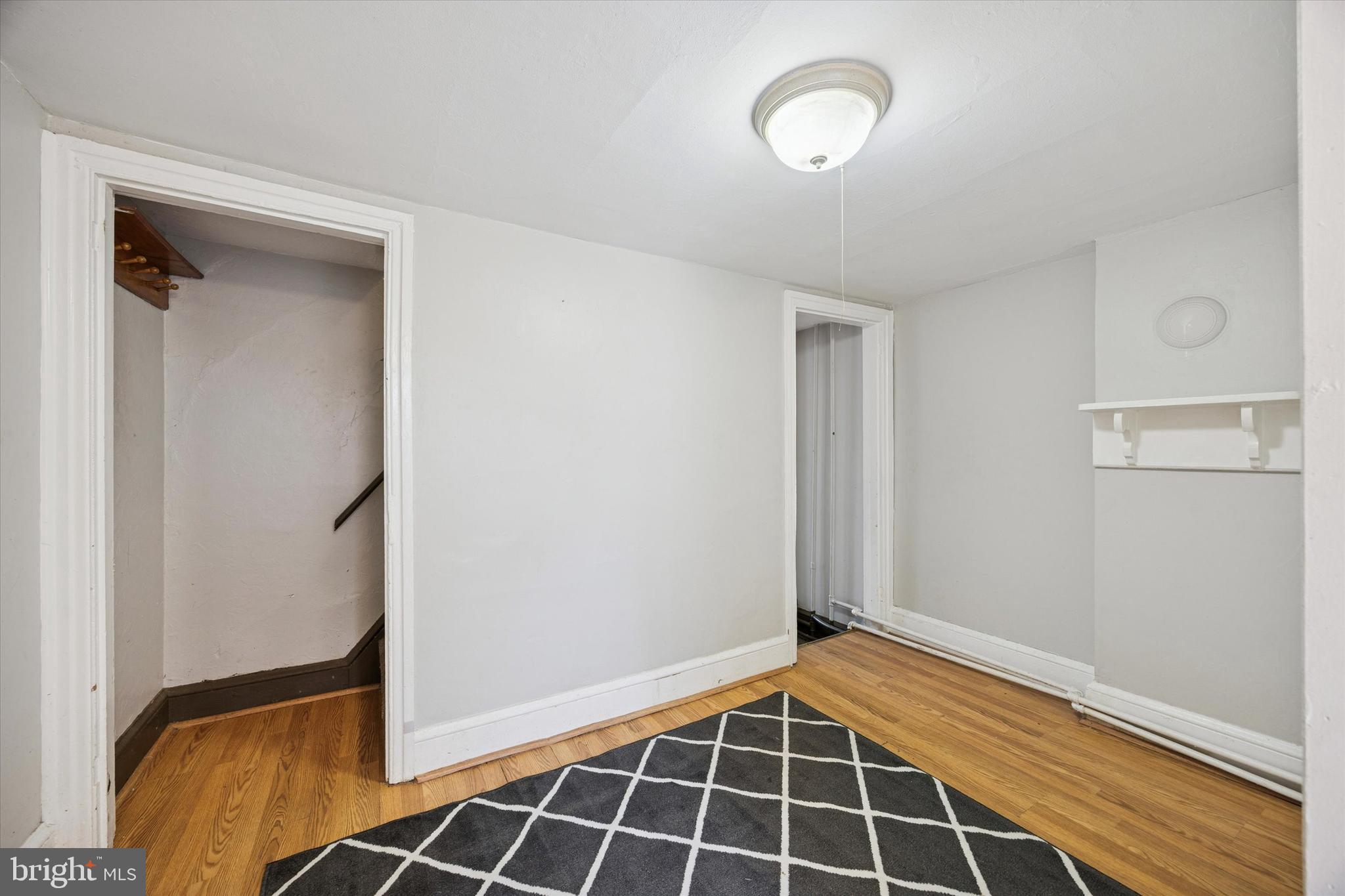 544 Walnut Street Pottstown, PA 19464 - Photo 10 of 14 a view of a room with wooden floor and a window