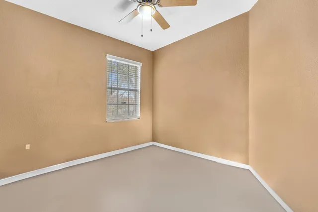 a view of a hallway with wooden floor and entryway