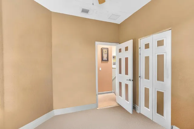 a view of a livingroom with an empty space and a window