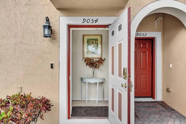 a view of hall way with furniture