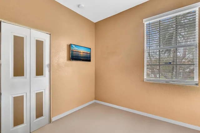 a bathroom with a tub shower and a mirror