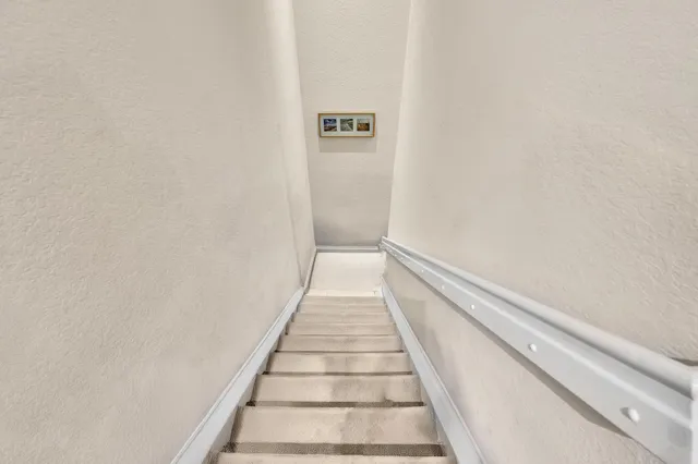 a bathroom with a sink mirror vanity and toilet