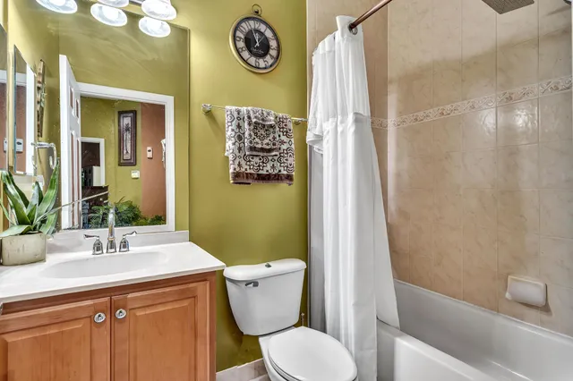 a view of a pathway with a garden