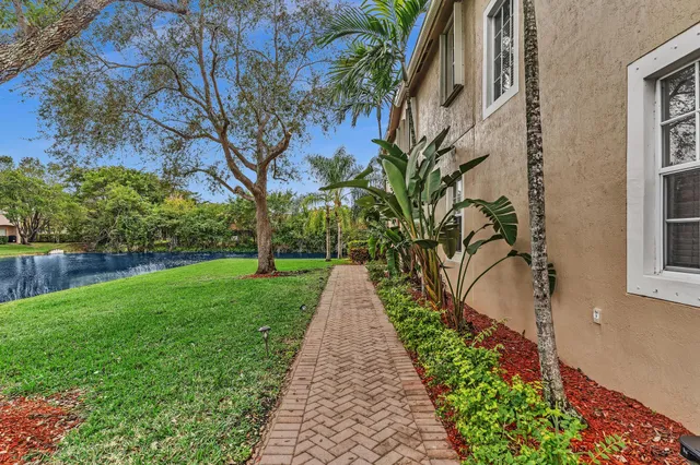 an aerial view of residential houses with outdoor space and seating