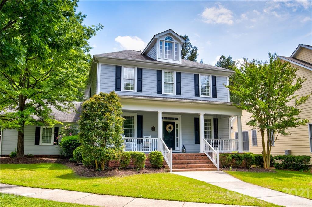 7155 Michael Scott Crossing Fort Mill, SC 29708 - Photo 2 of 41 a front view of a house with a yard
