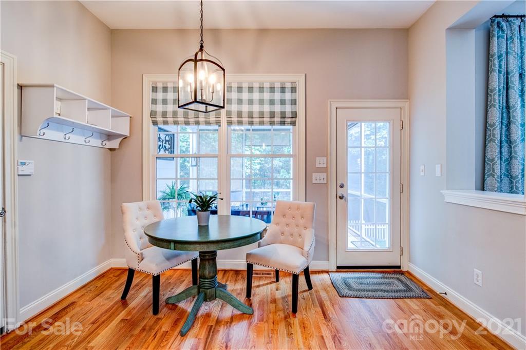 7155 Michael Scott Crossing Fort Mill, SC 29708 - Photo 15 of 41 a dining room with furniture and wooden floor
