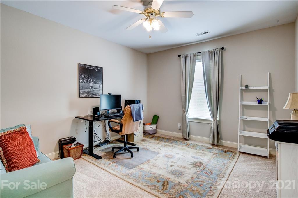 7155 Michael Scott Crossing Fort Mill, SC 29708 - Photo 22 of 41 a view of a workspace with furniture and gym equipment