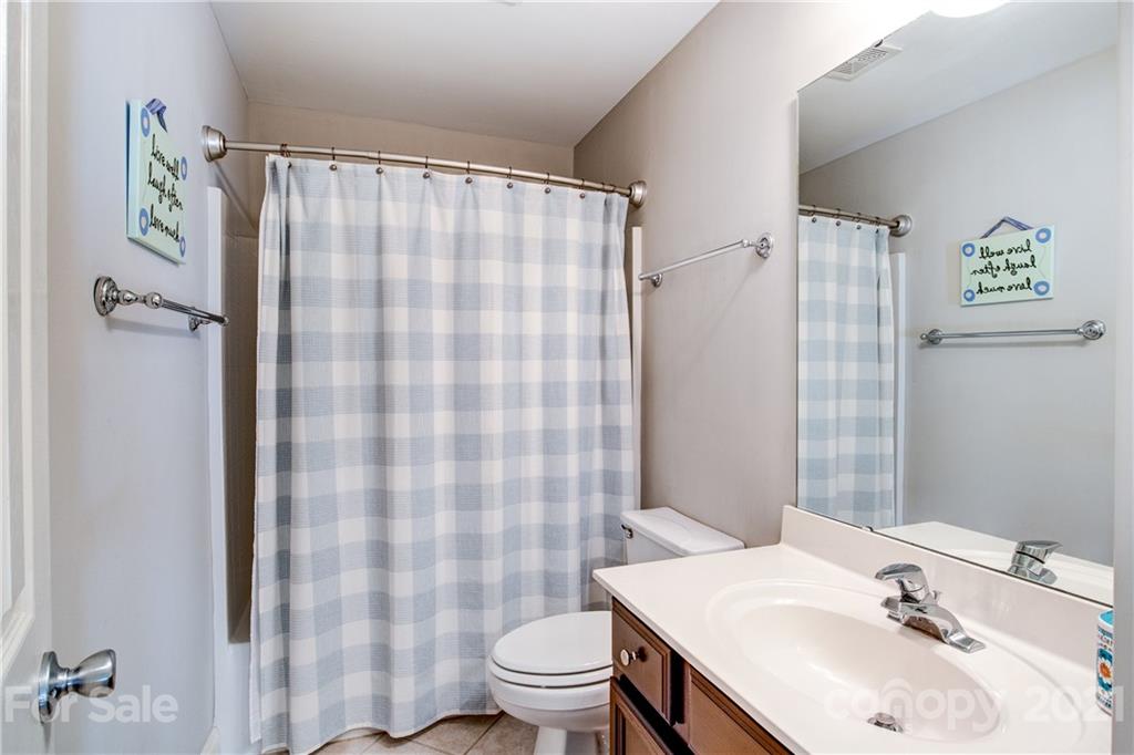 7155 Michael Scott Crossing Fort Mill, SC 29708 - Photo 24 of 41 a bathroom with a sink and a mirror
