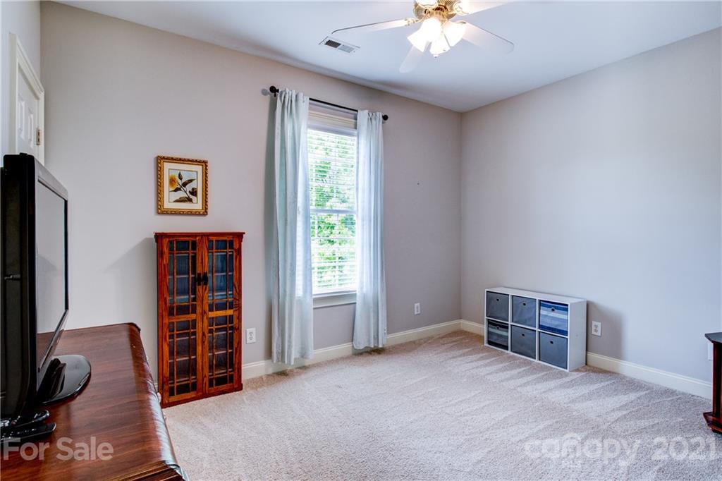 7155 Michael Scott Crossing Fort Mill, SC 29708 - Photo 25 of 41 a view of a bedroom with workspace and window