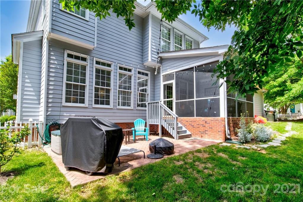 7155 Michael Scott Crossing Fort Mill, SC 29708 - Photo 29 of 41 a view of a house with backyard sitting area and garden