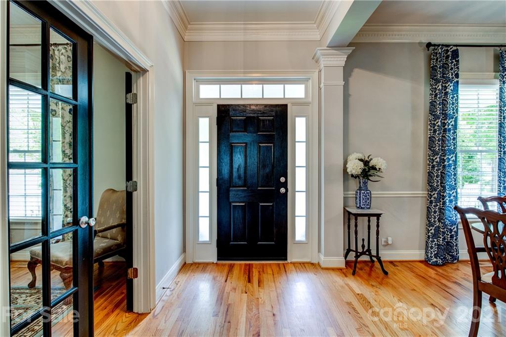 7155 Michael Scott Crossing Fort Mill, SC 29708 - Photo 6 of 41 a view of a hallway with wooden floor and windows