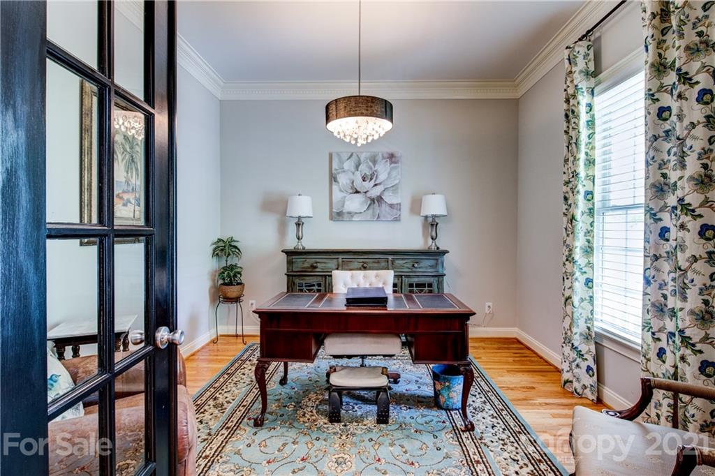7155 Michael Scott Crossing Fort Mill, SC 29708 - Photo 8 of 41 a dining room with furniture a window and a chandelier