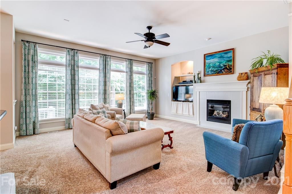 7155 Michael Scott Crossing Fort Mill, SC 29708 - Photo 10 of 41 a living room with furniture and a fireplace