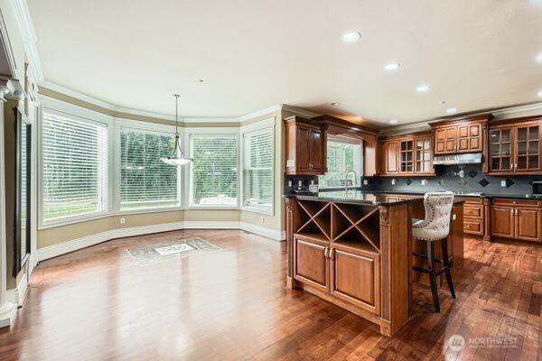 16925 Southeast 224th Street Kent, WA 98042 - Photo 11 of 21 a view of a kitchen with furniture and wooden floor