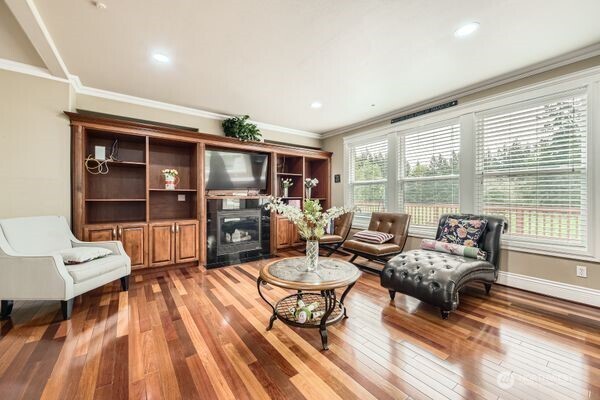 16925 Southeast 224th Street Kent, WA 98042 - Photo 12 of 21 a living room with furniture and a wooden floor