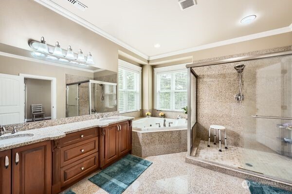 16925 Southeast 224th Street Kent, WA 98042 - Photo 16 of 21 a large bathroom with a double vanity sink large mirror and a bathtub