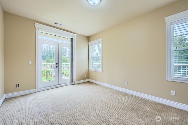 16925 Southeast 224th Street Kent, WA 98042 - Photo 18 of 21 a view of an empty room with a window