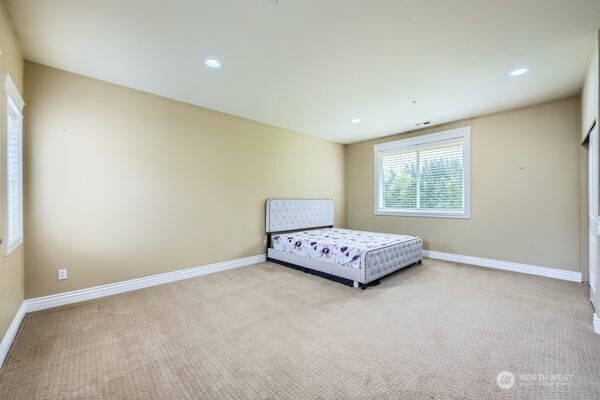 16925 Southeast 224th Street Kent, WA 98042 - Photo 19 of 21 a bedroom with a bed and a window