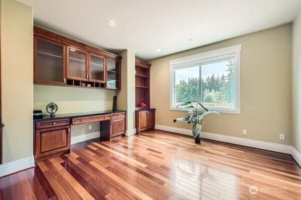 a bedroom with furniture and a window