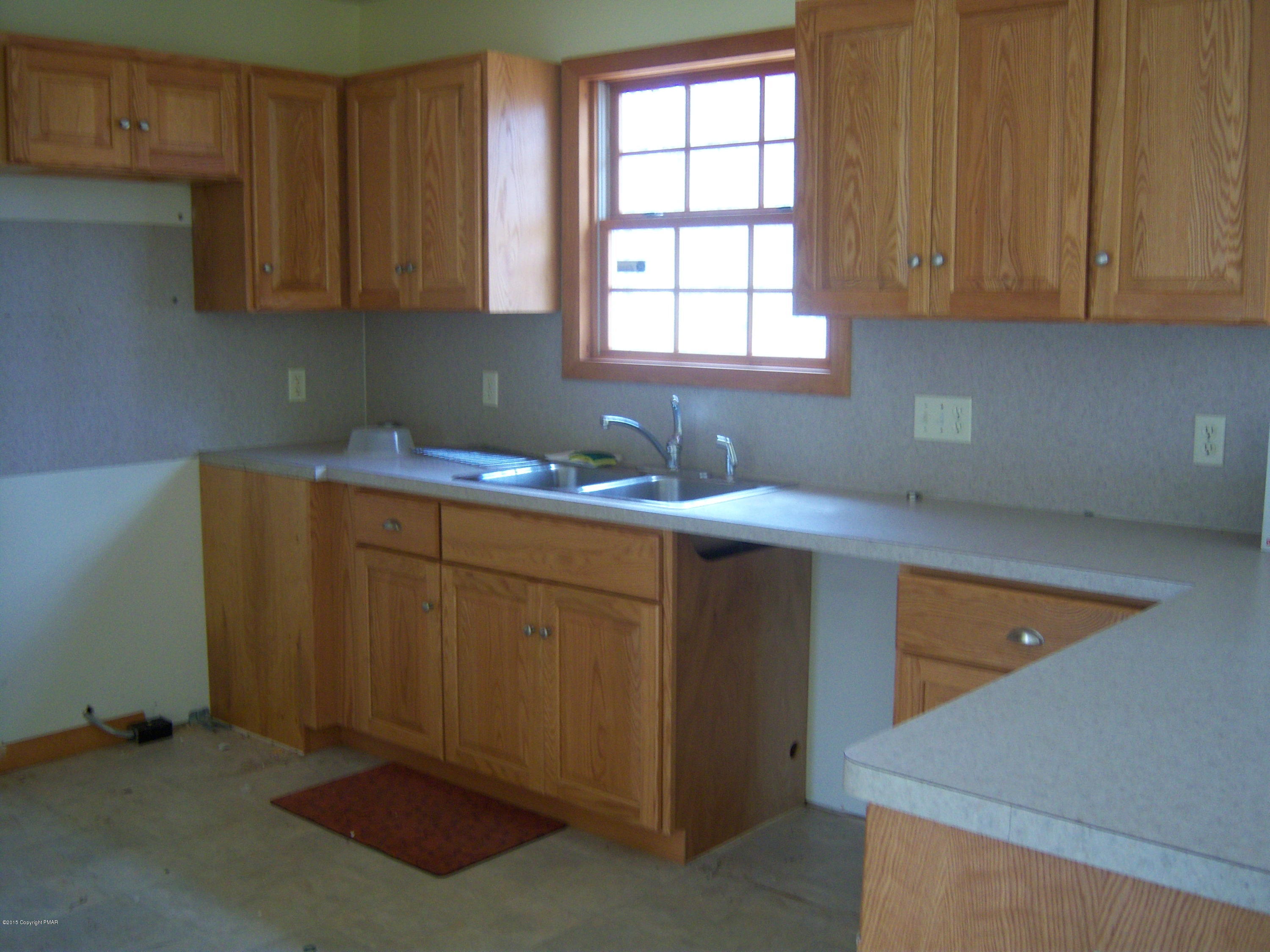 Winchester Road Pocono Summit, PA 18346 - Photo 4 of 7 a kitchen with a sink cabinets and window