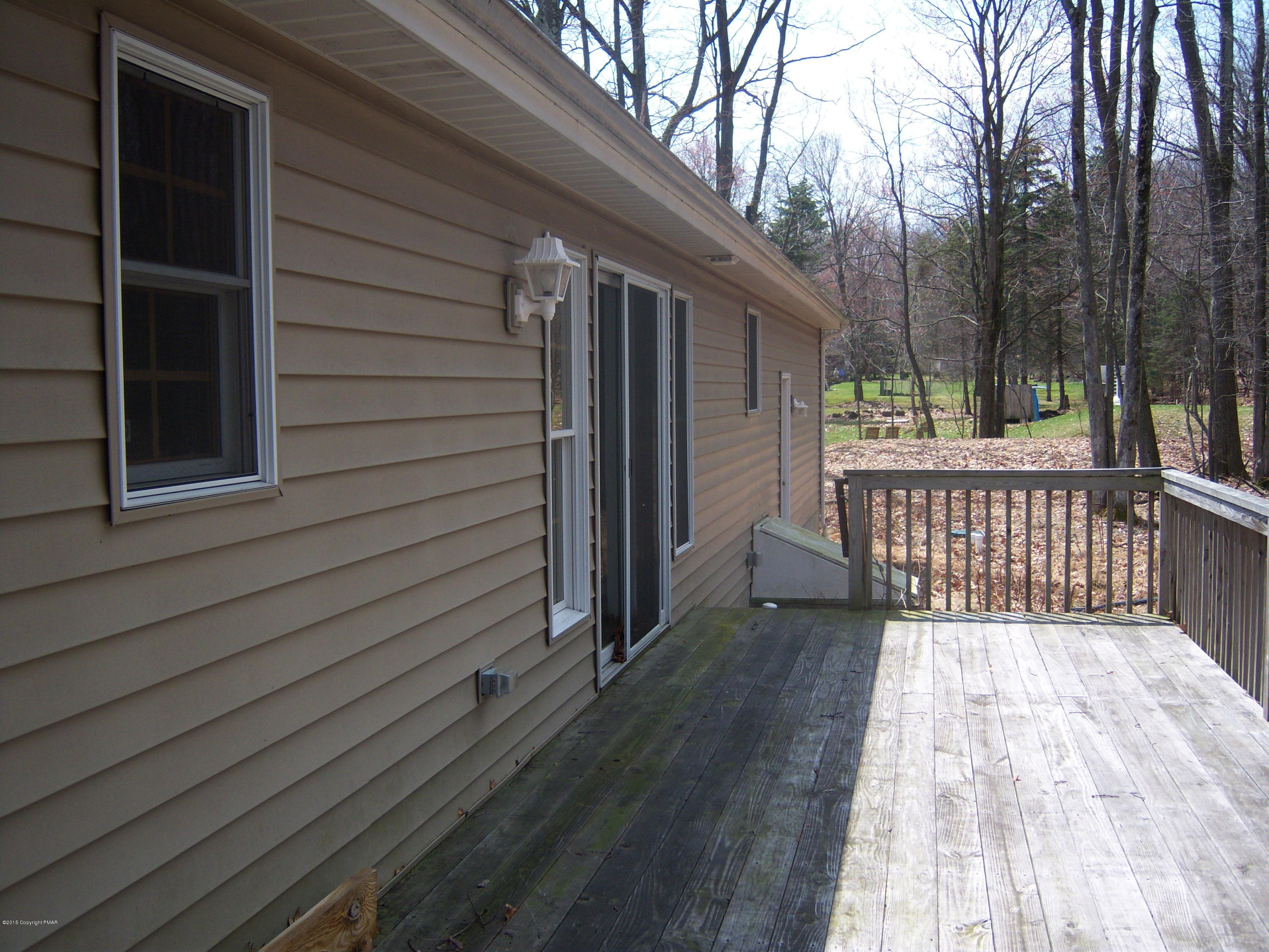 Winchester Road Pocono Summit, PA 18346 - Photo 7 of 7 a view of backyard with deck and wooden floor
