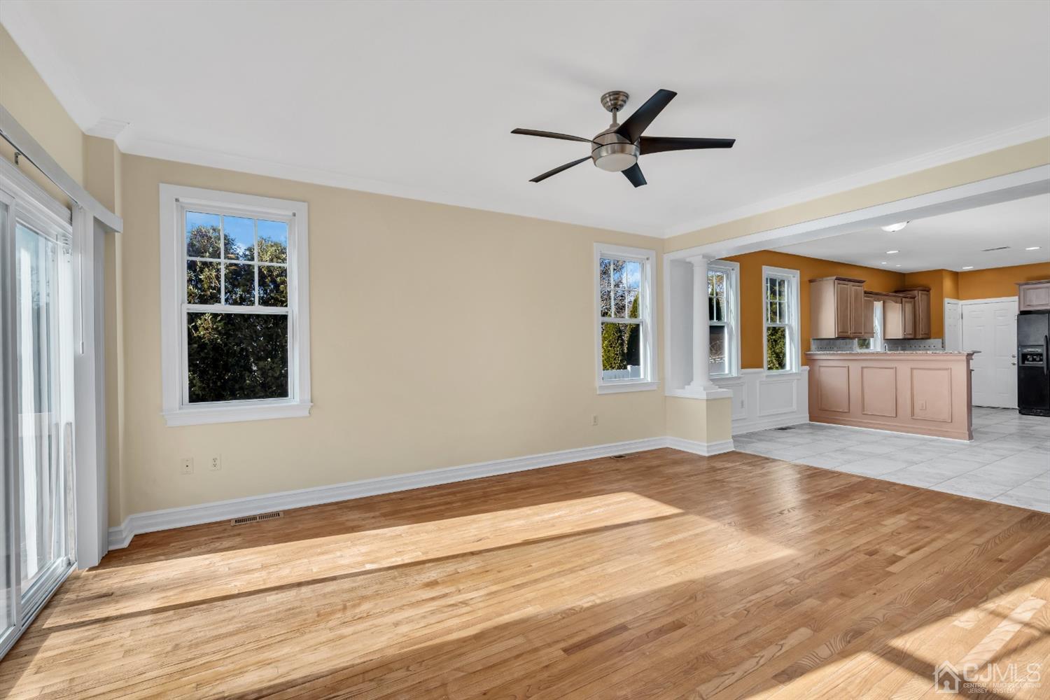 660 Ridge Road Monmouth Junction, NJ 08852 - Photo 14 of 52 a view of an empty room with wooden floor and a window