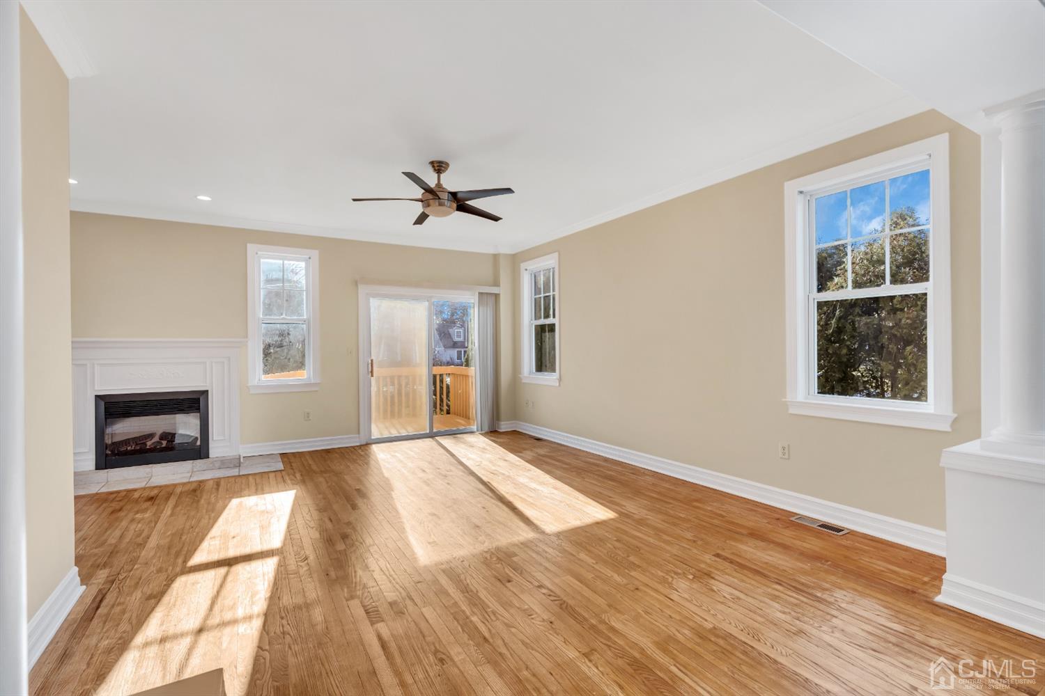 660 Ridge Road Monmouth Junction, NJ 08852 - Photo 16 of 52 a view of an empty room with a window and fireplace