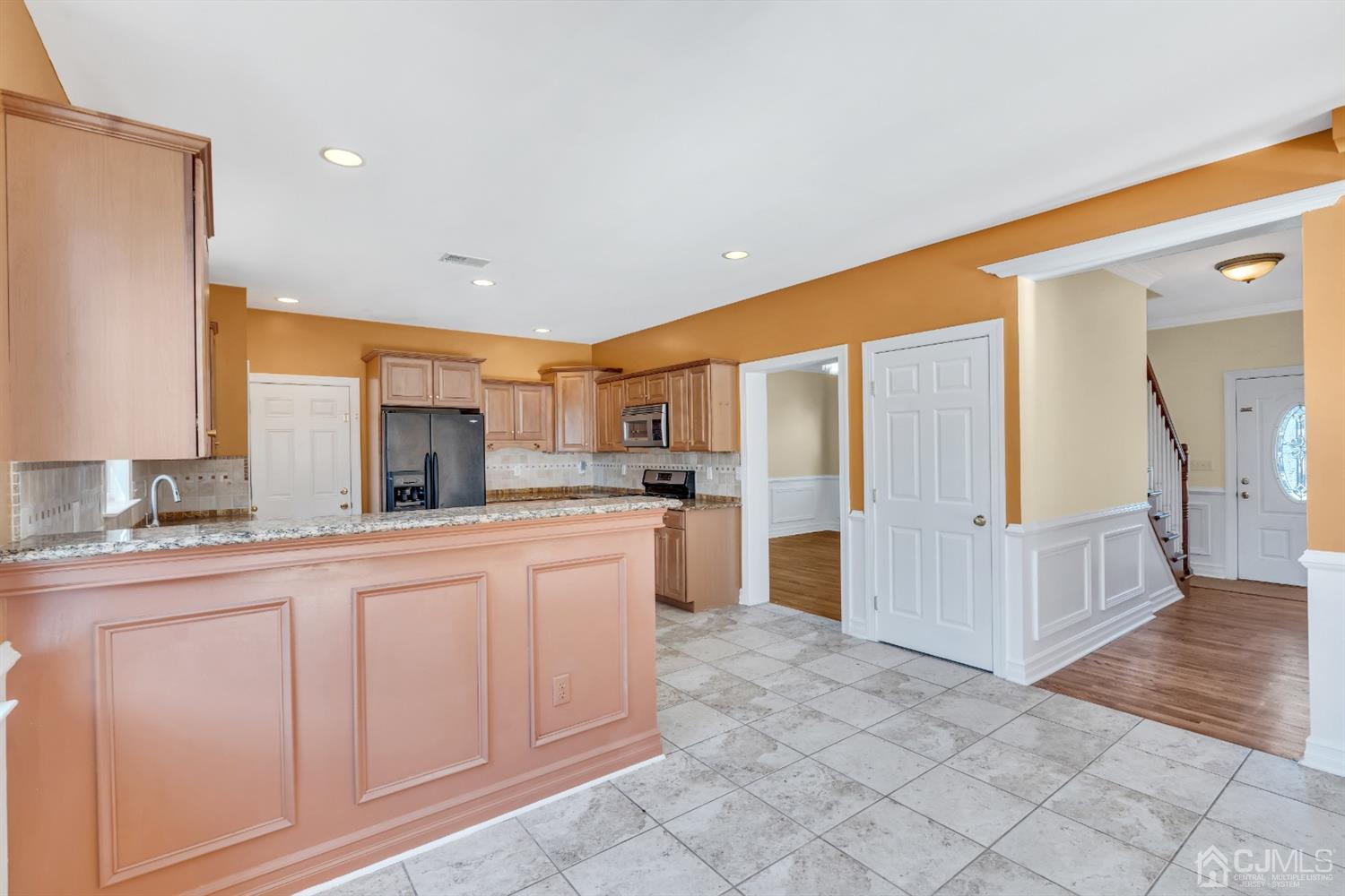 660 Ridge Road Monmouth Junction, NJ 08852 - Photo 20 of 52 a large kitchen with stainless steel appliances a refrigerator and a sink