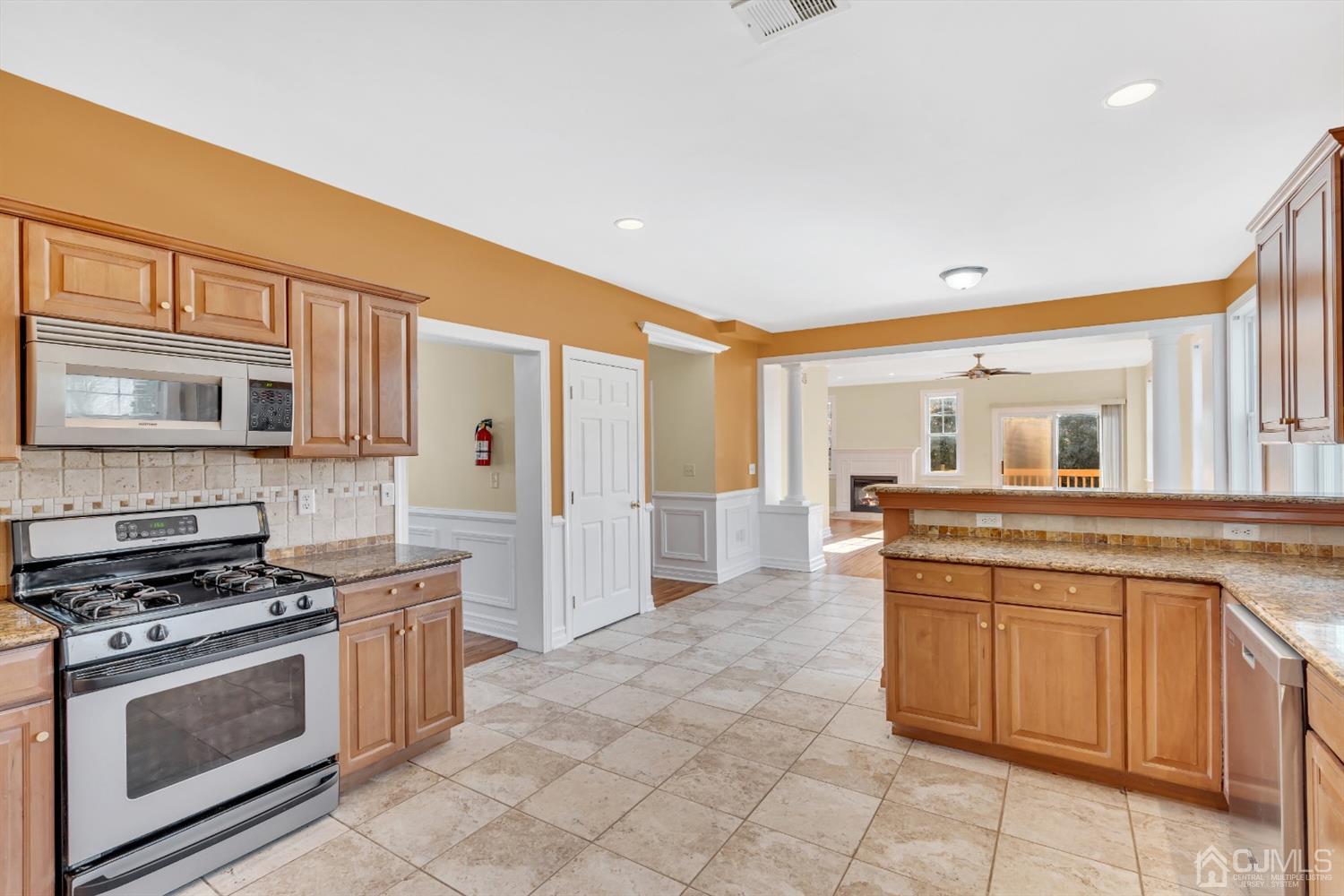 660 Ridge Road Monmouth Junction, NJ 08852 - Photo 23 of 52 a kitchen with a stove and a sink