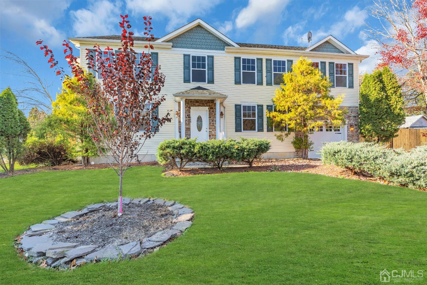 660 Ridge Road Monmouth Junction, NJ 08852 - Photo 4 of 52 a front view of a house with a garden