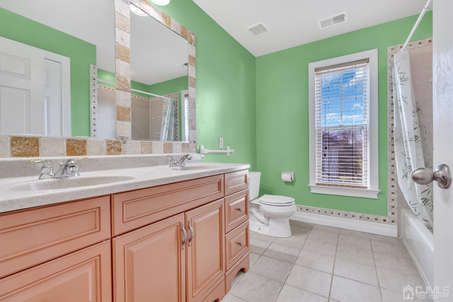 660 Ridge Road Monmouth Junction, NJ 08852 - Photo 38 of 52 a bathroom with a granite countertop toilet sink and mirror