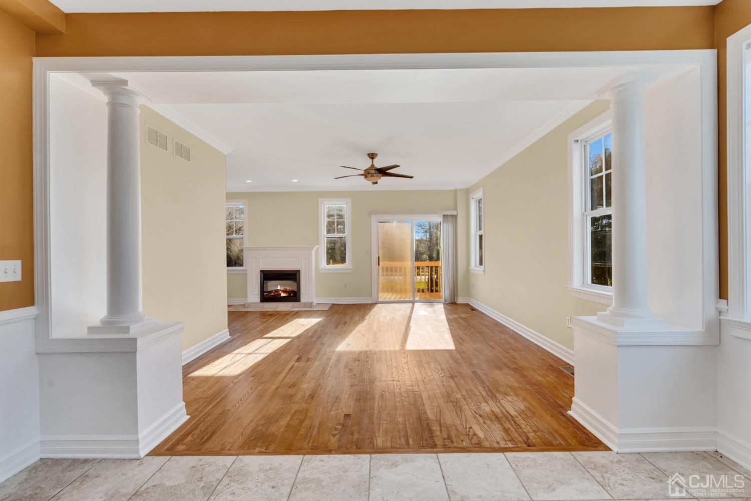 660 Ridge Road Monmouth Junction, NJ 08852 - Photo 5 of 52 a view of a livingroom with wooden floor and a fireplace