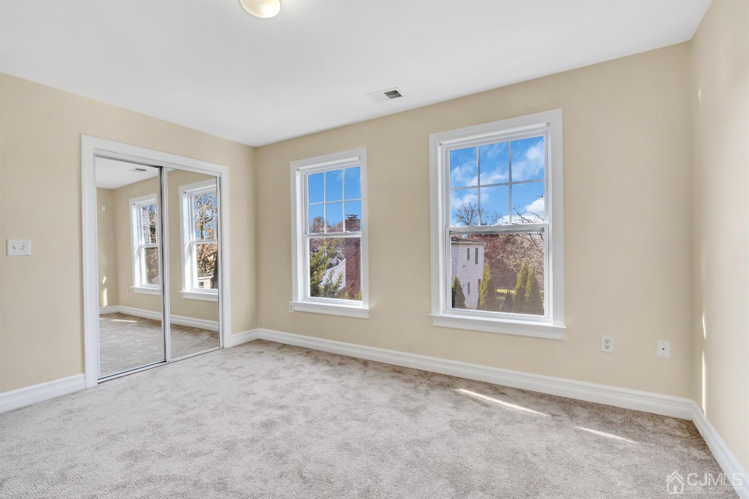 660 Ridge Road Monmouth Junction, NJ 08852 - Photo 41 of 52 an empty room with windows and closet