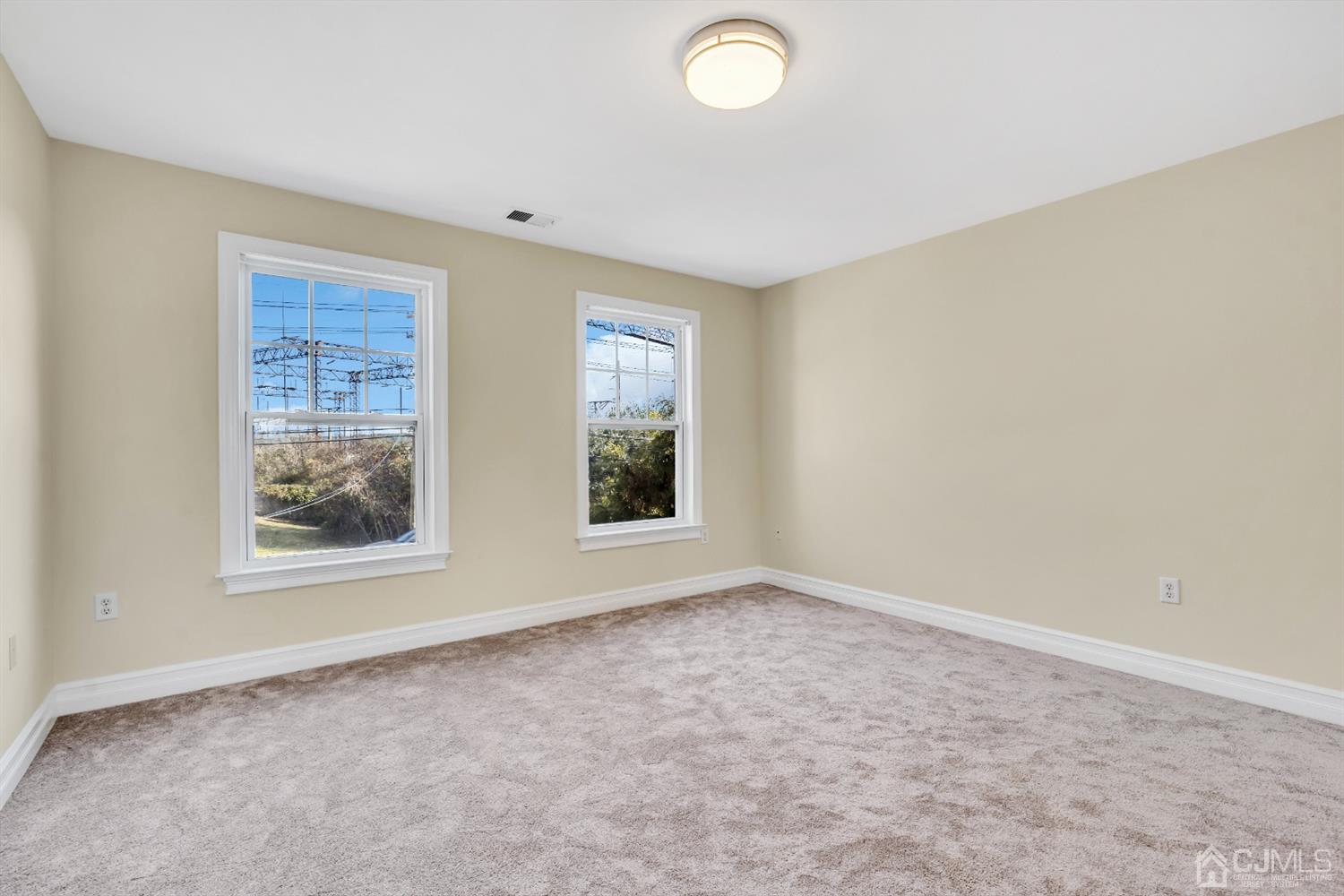 660 Ridge Road Monmouth Junction, NJ 08852 - Photo 43 of 52 an empty room with windows