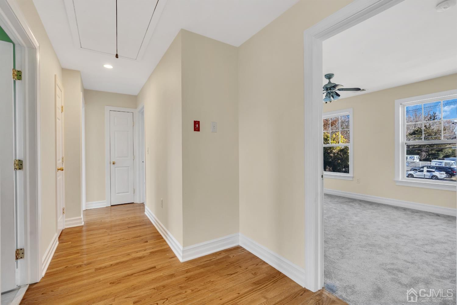 660 Ridge Road Monmouth Junction, NJ 08852 - Photo 45 of 52 a view of a hallway with wooden floor and closet