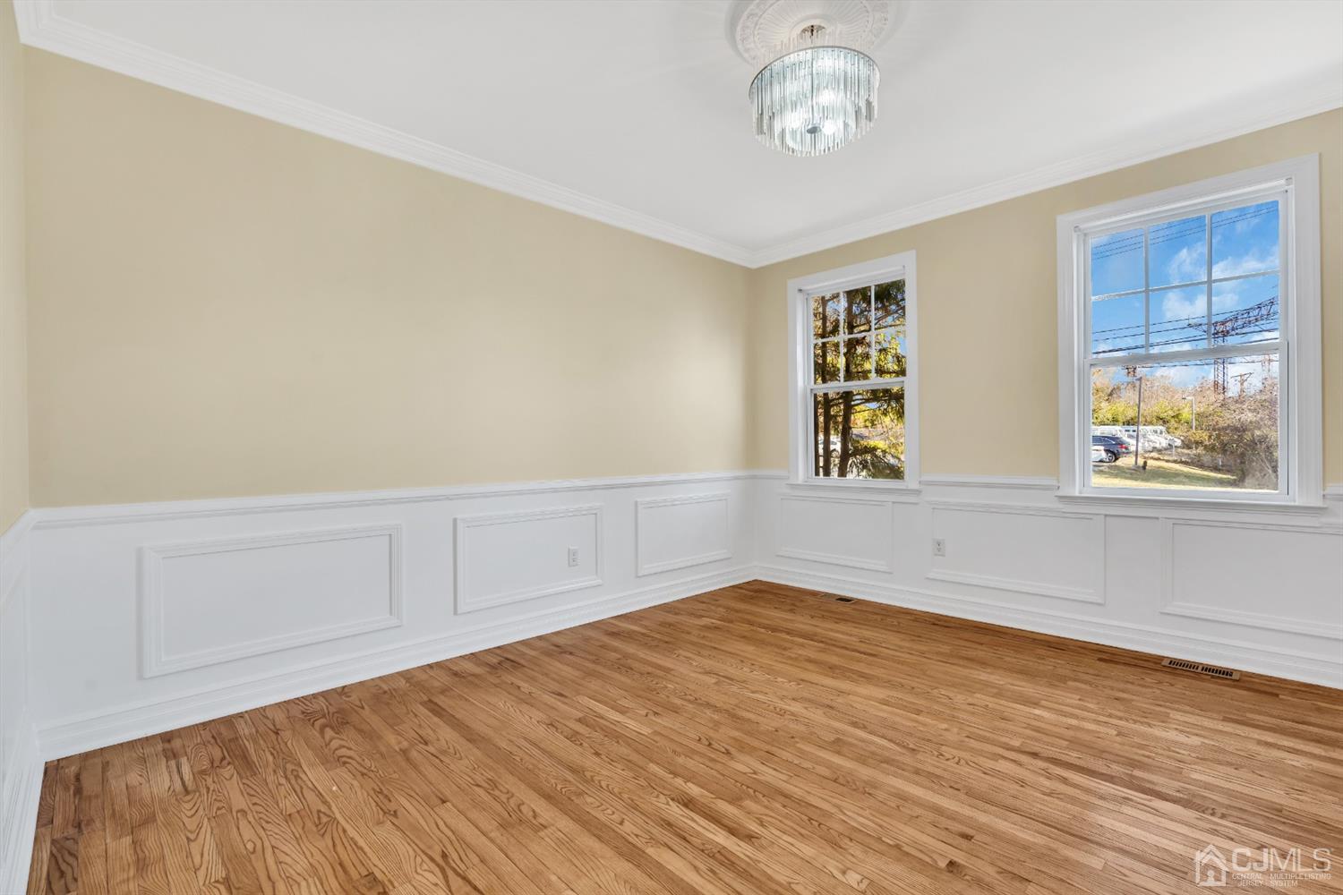 660 Ridge Road Monmouth Junction, NJ 08852 - Photo 6 of 52 wooden floor in an empty room with a window