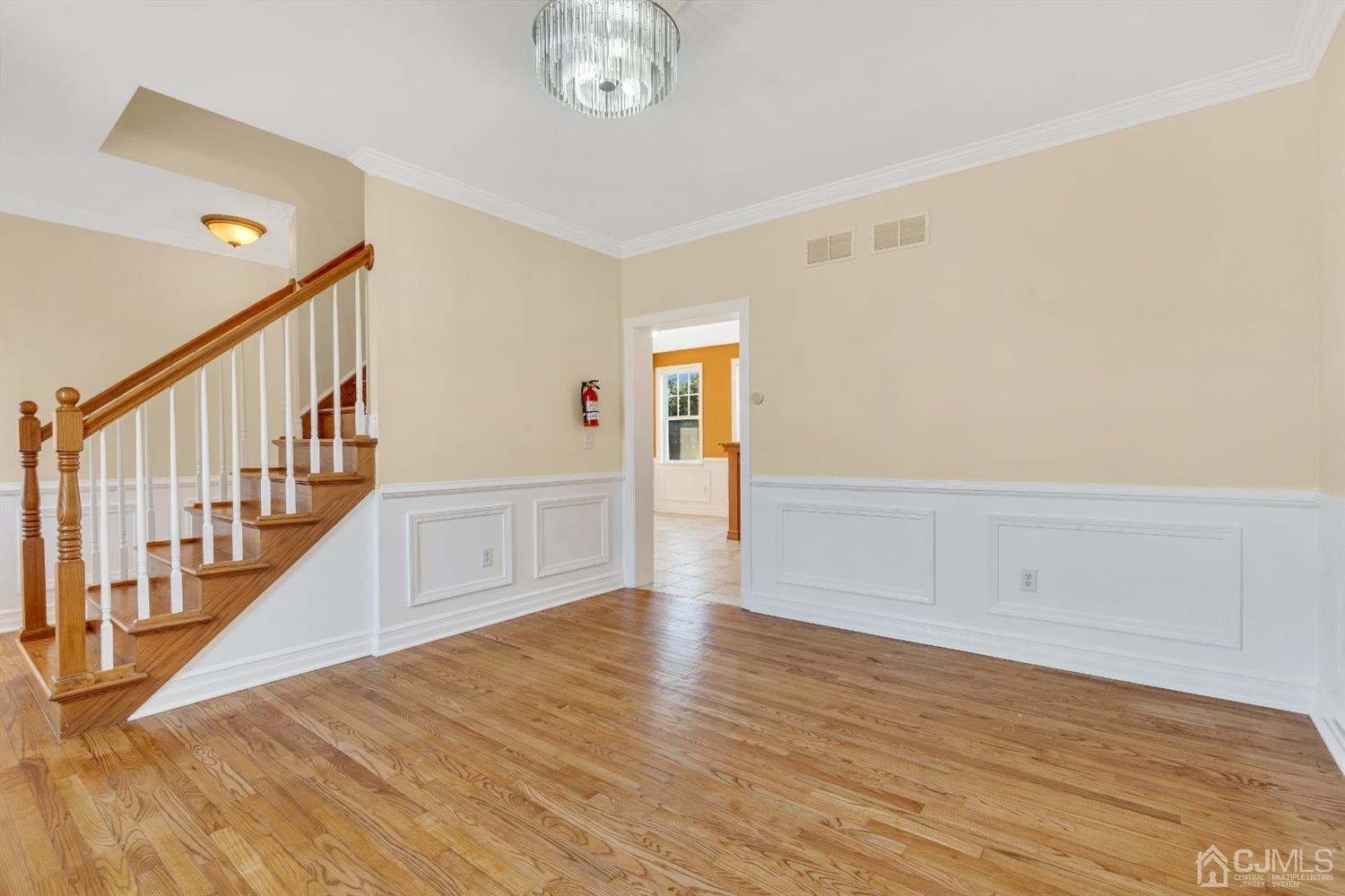 660 Ridge Road Monmouth Junction, NJ 08852 - Photo 8 of 52 a view of an empty room with wooden floor