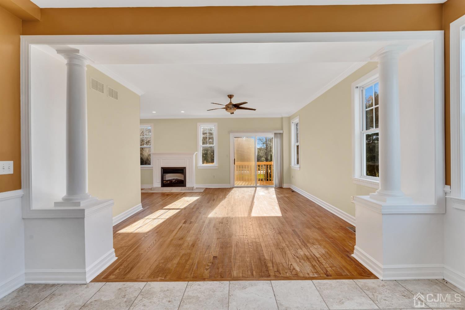660 Ridge Road Monmouth Junction, NJ 08852 - Photo 9 of 52 a view of a livingroom with wooden floor and kitchen view