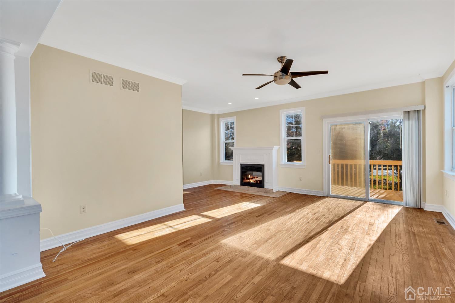 660 Ridge Road Monmouth Junction, NJ 08852 - Photo 10 of 52 a view of a bedroom with a bed and wooden floor