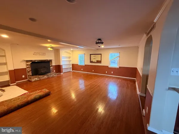 a view of a livingroom with furniture a flat screen tv
