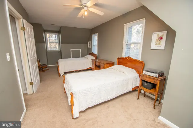 a bedroom with bed and window