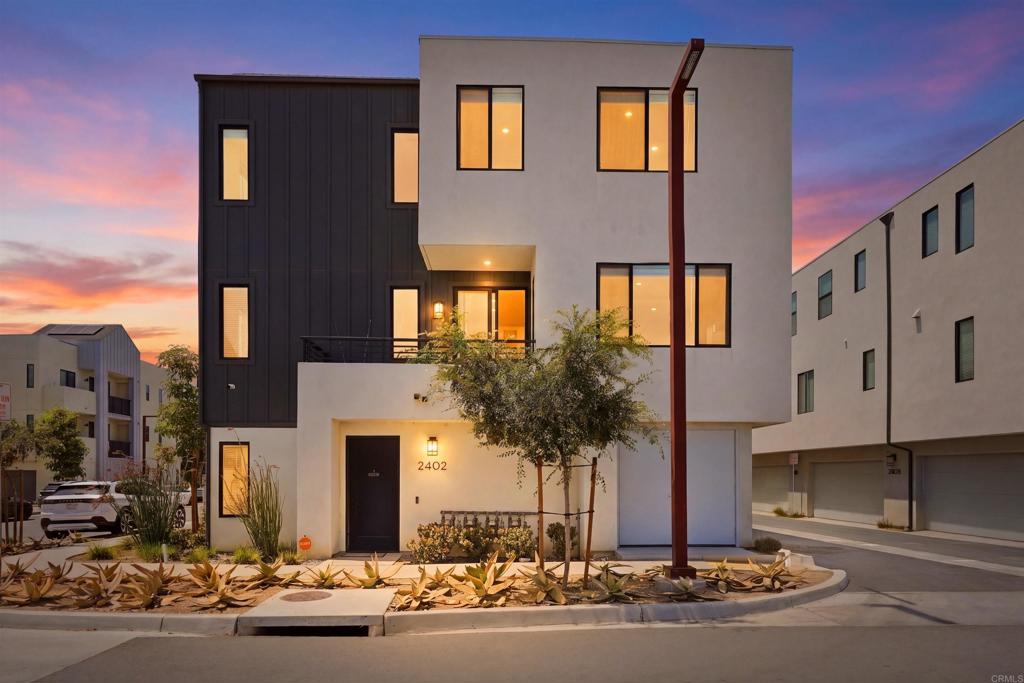 2402 Cascalote Loop San Diego, CA 92154 - Photo 2 of 35 a front view of a building with street view
